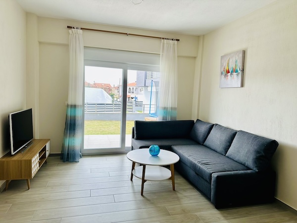 Cozy seating area in Lora Family Apartment with modern decor and warm atmosphere